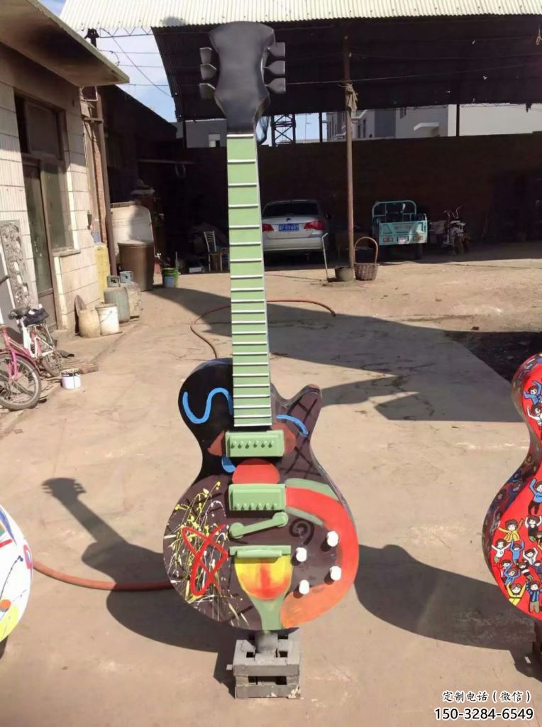 草地吉他雕塑 現(xiàn)代校園小品 大型雕塑